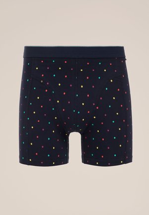 Tengerészkék boxer alsó, puha anyagból készült, több színben pompázó pöttyökkel, kényelmes derékrész kialakítással és klasszikus illeszkedéssel.