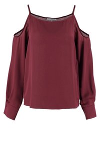 Blouse bordeaux à épaules dénudées avec manches longues, coupe ample et texture lisse. Équipée de bretelles spaghetti et d'un ourlet incurvé.