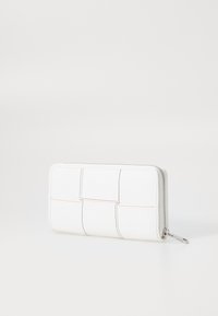 White zippered wallet featuring a textured quilted design with visible stitching details in orange and yellow. Compact rectangular shape.