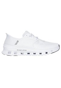 Zapatilla deportiva blanca con parte superior de malla, diseño con cordones y suela de goma gruesa que presenta bolsas de aire visibles para amortiguación y soporte.