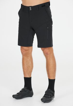 Zwarte shorts van lichtgewicht stof, met een ritszak aan de zijkant, knoopsluiting en een getailleerde pasvorm met zichtbare naden.