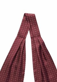 Burgundy solmio, jossa on valkoisia pilkkuja, valmistettu kudotusta kankaasta. Solmiolla on tasainen, sileä pinta ja terävät päät.