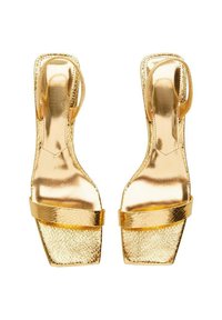 Gold leather high-heeled sandals feature a textured finish, open toe, and wide strap across the front, with a slingback design and square heel.