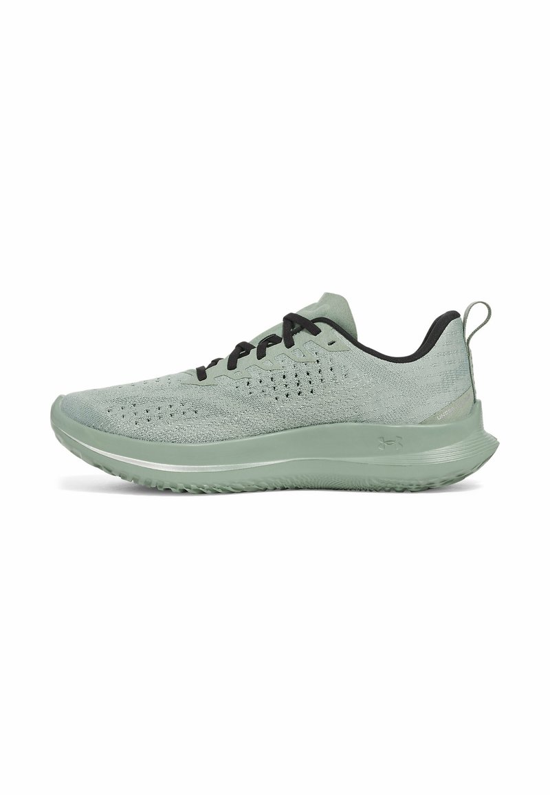 Light green athletic shoe with a textured mesh upper, black laces, and a cushioned sole. Features a tab on the heel for easy wear.