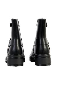Black leather ankle boots with a sturdy sole, featuring a strap detail and button accent at the back. Smooth texture with a glossy finish.
