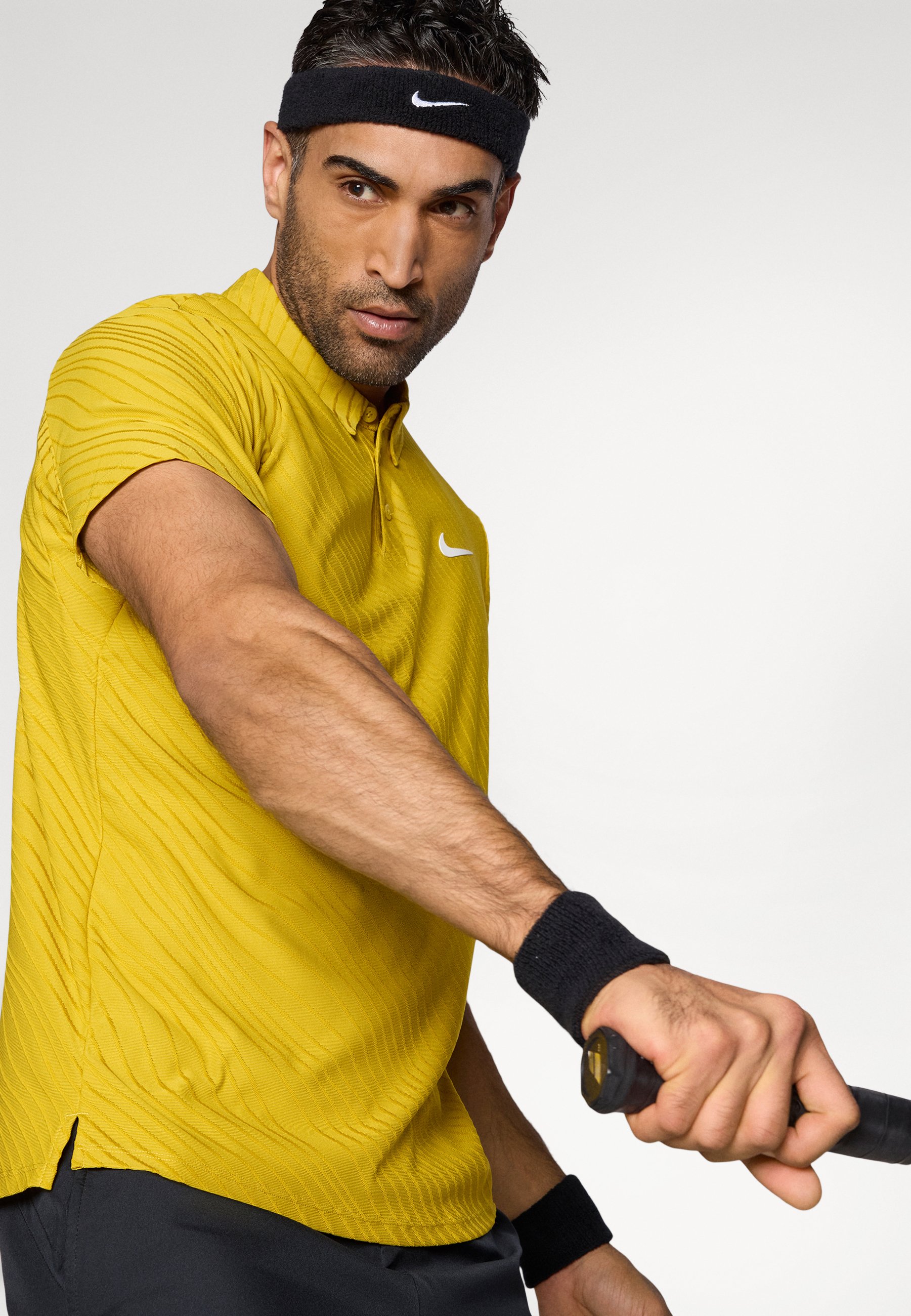 yellow nike tennis shirt