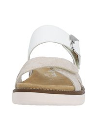 Beige suede and white synthetic sandals with a wide strap, silver buckle detail, cushioned insole, and a white rubber sole.