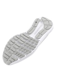 Suela de zapato en goma blanca con patrones de agarre texturizados; presenta líneas onduladas y nódulos circulares para tracción y flexibilidad.