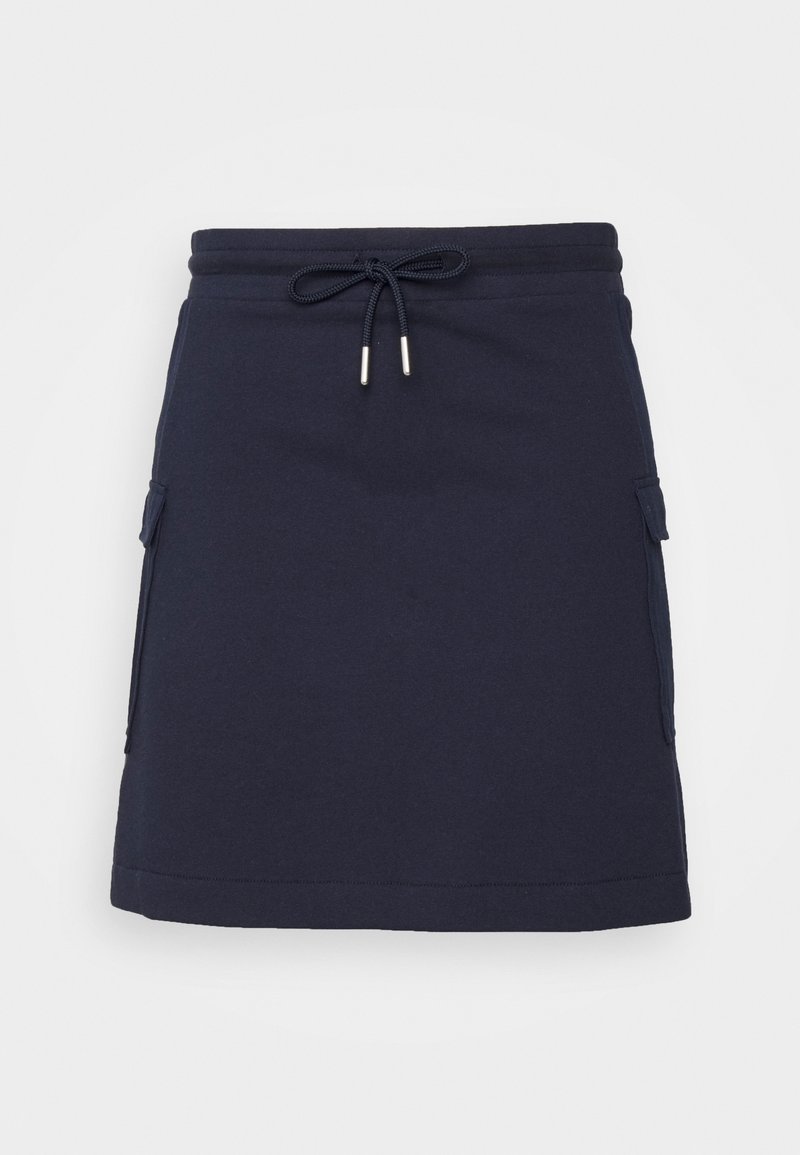 Jupe bleu marine longueur genou avec taille élastique, cordon de serrage et poches à rabat de chaque côté.