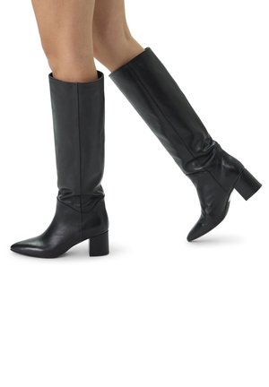 Black leather knee-high boots with a pointed toe and chunky block heel. Features smooth texture and slouchy design at the calf.