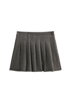 Gonna plissettata in bianco e nero a motivo houndstooth con vita aderente e tessuto testurizzato, caratterizzata da una silhouette svasata e lunghezza a metà coscia.
