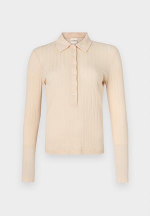 Langärmliges Polo-Shirt aus leichtem Pfirsichfarbenem Rippstoff, mit klassischem Kragen, sieben Knöpfen und körpernahem Schnitt.