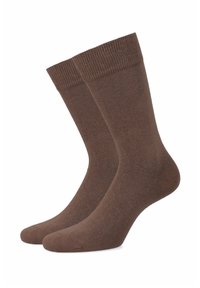 Brązowe skarpetki sięgające do połowy łydki, wykonane z miękkiego, gładkiego materiału, z prążkowanym ściągaczem i bezszwowym końcem palców dla komfortu i trwałości.