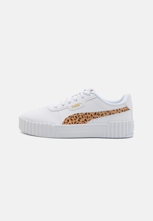 White sneakers with a textured animal print accent on the side, featuring a thick sole and round toe. Branding visible on the upper.