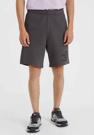 Gray cotton shorts with an elastic waistband and side pockets. Features printed text on the lower leg. Soft texture, knee-length design.