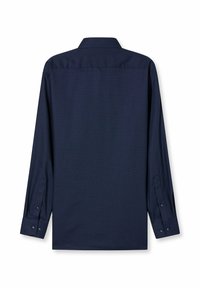 Marineblaues Langarmhemd liegt flach da und zeigt den Rücken mit geknöpften Manschetten und einem klassischen Kragen.