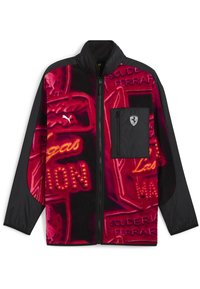 Black and red zip-up jacket with neon-style Las Vegas and Scuderia Ferrari text patterns, Puma logo, and zippered chest pocket with Ferrari emblem.