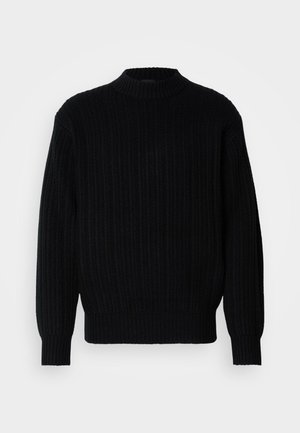 Sweater preto em malha canelada com gola alta, mangas longas e um corte relaxado. O tecido apresenta um padrão texturizado por toda a superfície.