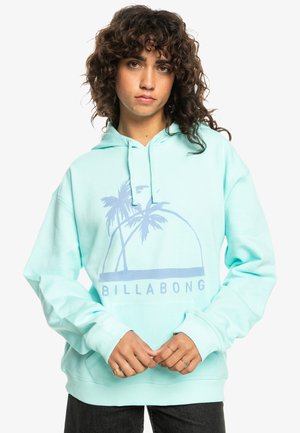 Muntgroene hoodie met een voorzak in kangoeroestijl, een capuchon met trekkoord en een palmbomengrafiek. Zachte structuur en een relaxte pasvorm voor comfort.