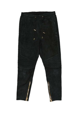 Black jogger pants with drawstring waist, quilted knee panels, and gold zippers at the lower leg cuffs.