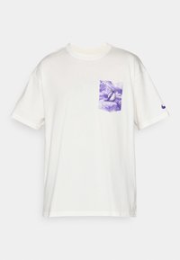White cotton t-shirt with short sleeves, featuring a purple tie-dye chest pocket and a small purple logo on the sleeve.