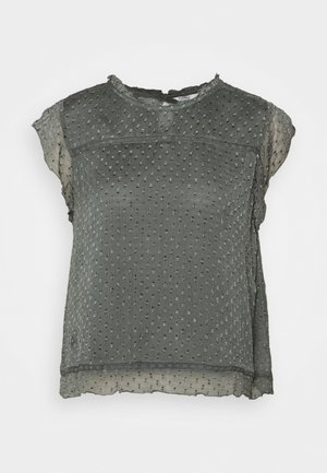 Mørkegrå bluse med struktureret overflade og små, hævede prikker. Har en rund halsudskæring og korte ærmer med en let gennemsigtig finish.