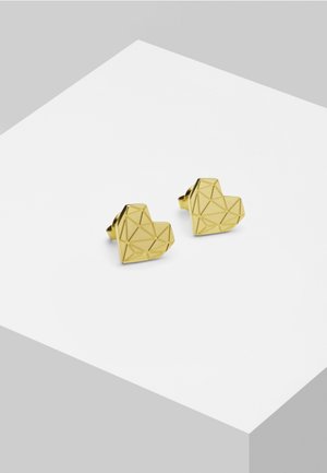 Boucles d'oreilles en forme de cœur géométrique en or avec un design facetté, présentant une finition lisse et des angles contrastés pour un intérêt visuel.