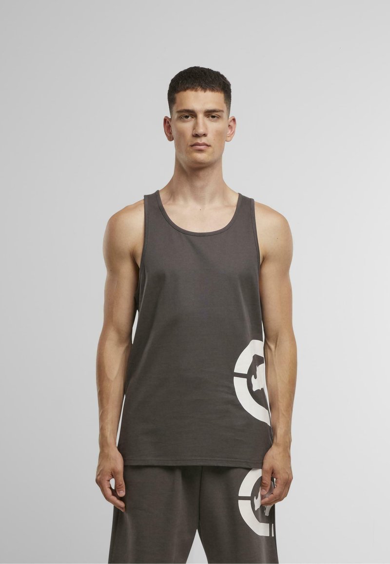 Gray tank top made of cotton blend, featuring a round neckline and a large white printed graphic on the bottom right. Simple, lightweight design.