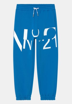 Pantalon de survêtement bleu avec poignets et taille élastiques, cordon blanc, et grand texte graphique blanc partiellement formant "N°21" sur le devant.