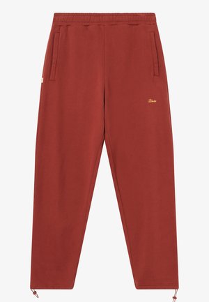 Rode sweatpants met een drawstring tailleband, twee zijzakken en gouden logo borduurwerk nabij de linkse zak. Zachte stof met een gladde textuur.