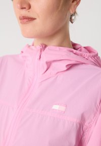 Tommy Jeans OUTDOOR JACKET - Summer jacket - carnival pink