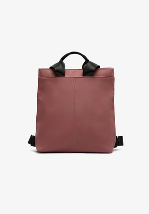 Rose pink tote bag with black straps, made from smooth material. Features a minimalist design with a top handle and adjustable shoulder straps.