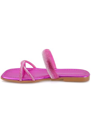 Pink flat sandals with shiny, metallic straps and a textured band. The sole is light brown, featuring a smooth finish and minimalist design.