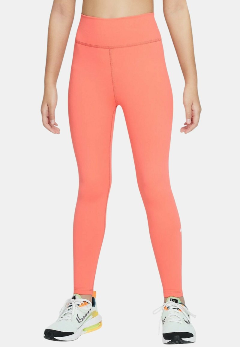 Leggings a vita alta e senza cuciture in un vivace corallo, con una superficie liscia. Presenta un design aderente e un branding minimale vicino alla caviglia.