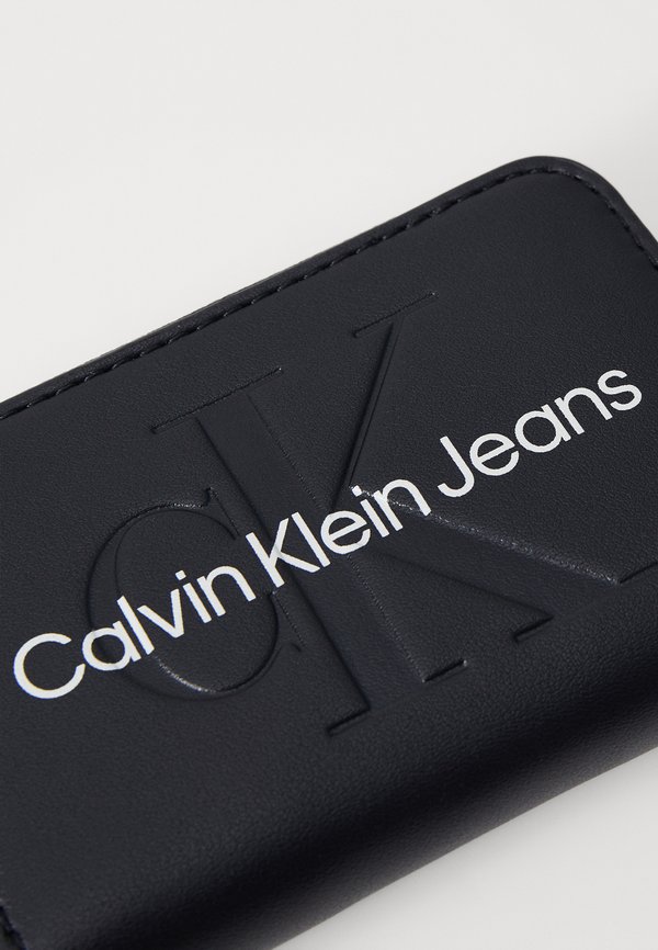 SCULPTED ZIP AROUND - Wallet3