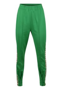 Gröna, släta sportbyxor med elastisk midja, med sidopaneler i ett brunt mönster och tryckknappar vid anklarna.