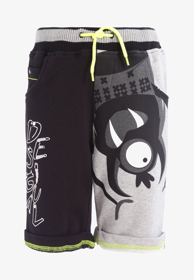 Bicolor shorts: de ene kant zwart met witte tekst, de andere kant grijs met een grote zwarte cartoon oog. Elastische tailleband met gele koord.