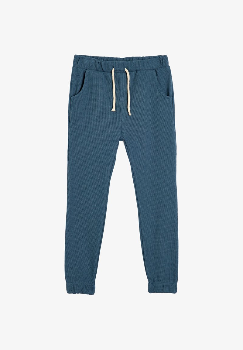 Blaue Waffelstrick-Jogginghosen mit elastischem Bund, beigem Kordelzug, Seitentaschen und elastischen Bündchen.