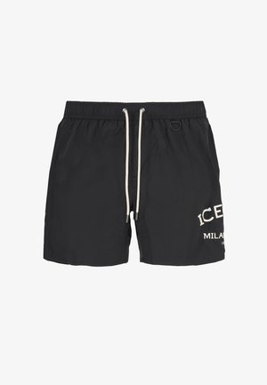 Pantaloni da nuoto neri realizzati in tessuto leggero, con vita regolabile tramite cordoncino e testo bianco stampato nella parte inferiore sinistra.