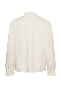 Blusa lunga a maniche corte color crema con alto collo arricciato e polsini arricciati con arricciatura, vista da dietro.