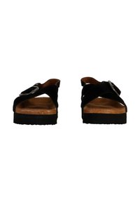 Sandalias de ante negro con una plantilla de corcho, que presentan tiras cruzadas y un detalle de hebilla plateada. Suela plana con fondo de goma texturizada.