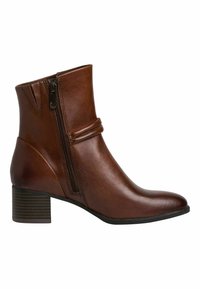 Bottine en cuir marron avec fermeture éclair latérale, talon bloc et détail cousu sur le devant, présentée de profil sur fond blanc.