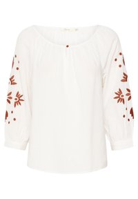 Blouse blanche avec broderie florale rouge sur les manches, décolleté arrondi et texture froncée. Manches longues et bouffantes avec des poignets élastiques.