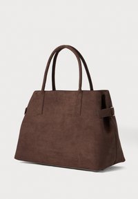 Brown suede tote bag with structured shape, dual top handles, and a side strap accent. Smooth texture with minimalist design.