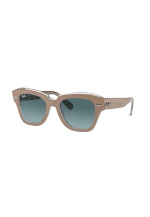 Occhiali da sole in plastica marrone con forma geometrica a occhio di gatto, lenti blu sfumate e dettagli in metallo silver sugli steli.