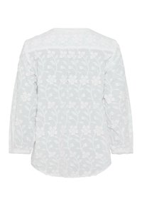 Weiße gestickte Bluse mit floralen Mustern, langen Ärmeln, rundem Ausschnitt und einem weichen, strukturierten Stoff. Rückansicht gezeigt.