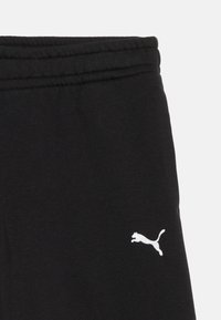 Μαύρη ζώνη μέσης παντελονιού με ελαστικό επάνω μέρος και μικρό λευκό λογότυπο Puma στο πλάι.