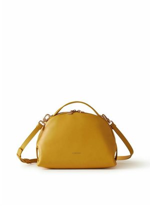 Yellow leather handbag with a rounded shape, top handle, and adjustable shoulder strap against a white background.