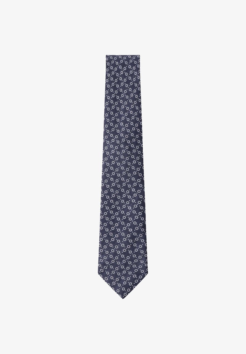 Corbata azul marino con un patrón floral blanco repetitivo. Confeccionada en tela, presenta un extremo puntiagudo y una textura suave. Las medidas son de longitud estándar.