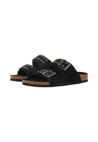 Sandalias de ante negro con doble hebilla ajustable, herrajes plateados y una plantilla de corcho. Suela texturizada para un buen agarre. Diseño de punta abierta.